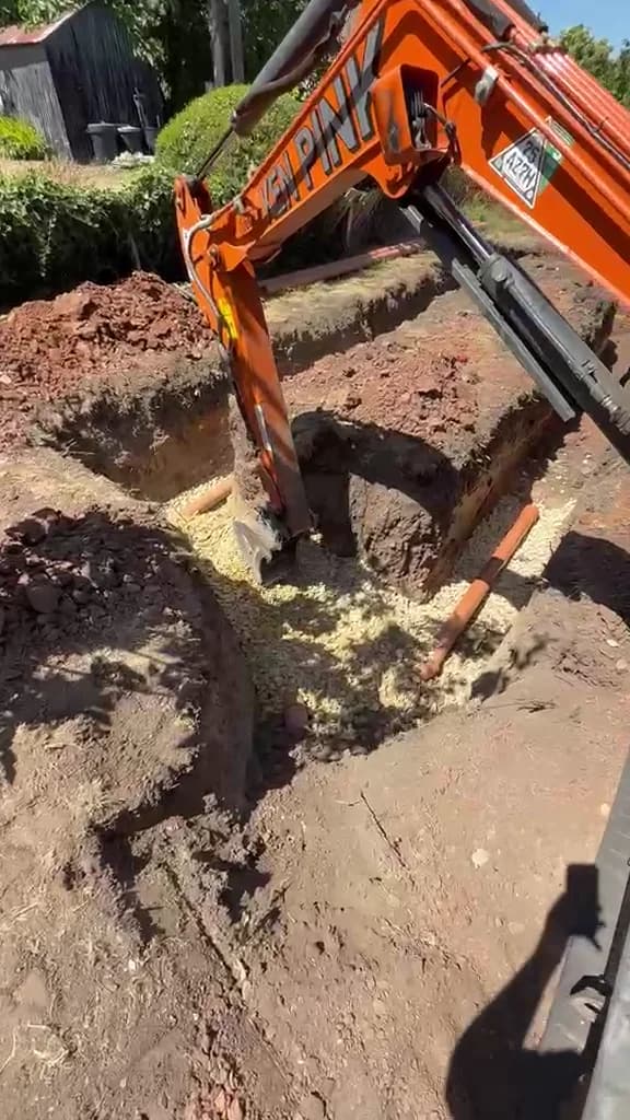 Prime Drainage excavator carrying out professional drainage work
