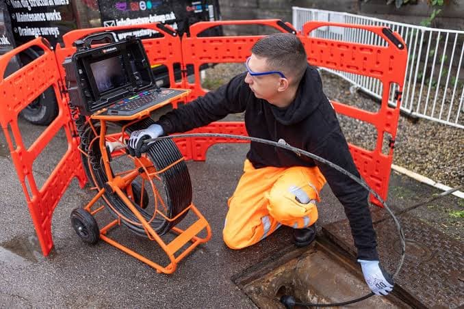 CCTV drain survey equipment in use at a drainage chamber
